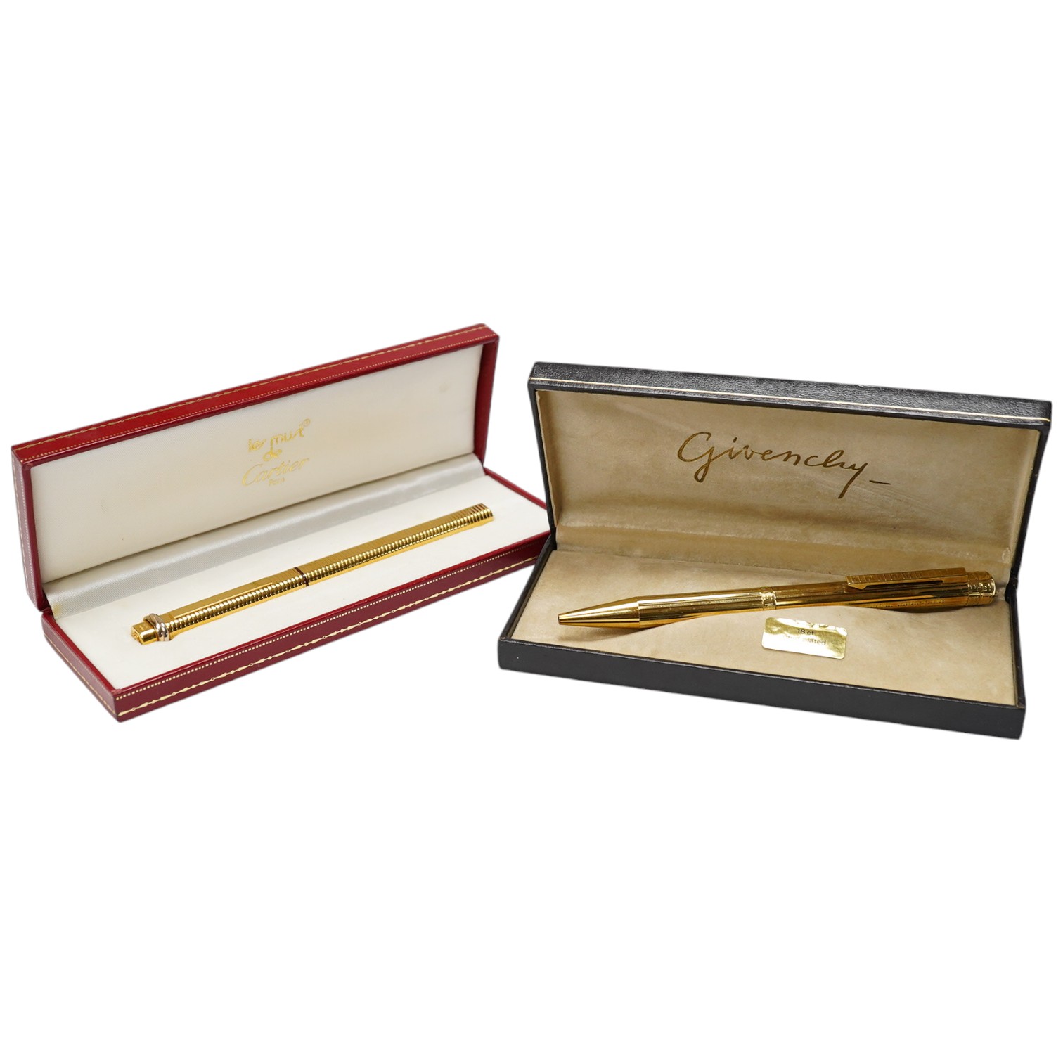 A Cartier gold plated pen and a Givenchy 18ct gold plated pen, both boxed. Cartier pen 13.5cm long. Condition - good, Givenchy box needs attention